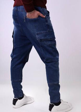 Стильні зручні сині чоловічі джинси карго чоловічі джинси з накладними кишенями джинси-карго демісезонні чоловічі джинси на резинці в поясі3 фото