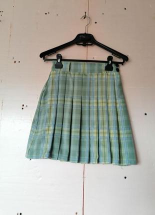 Міні спідниця в клітину пліссе