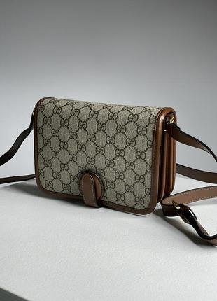 Сумка gucci mini из гладкой кожи с фирменной канвой.2 фото