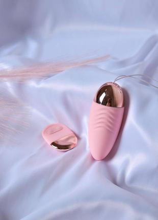 Розовое виброяйцо с дистанционным пультом управления