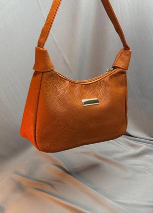 Классическая женская сумочка из экокожи.1 фото