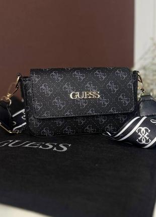 Женская маленькая черная сумка guess с плечевым ремнем.4 фото