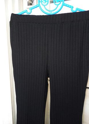 Модні чорні шкільні штани джинси брюки трикотажні кльош в рубчик висока посадка для дівчинки 9 років4 фото