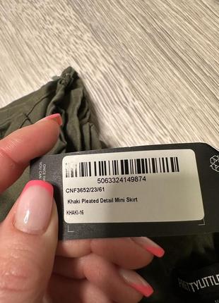 Мини-юбка цвета хаки с плиссированными деталями7 фото