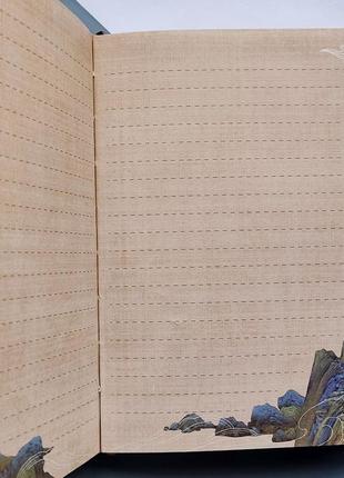 Блокнот з динамічним малюнком та комбінованою розміткою "людне містечко"