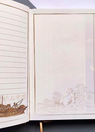 Блокнот з динамічним малюнком та комбінованою розміткою "людне містечко"