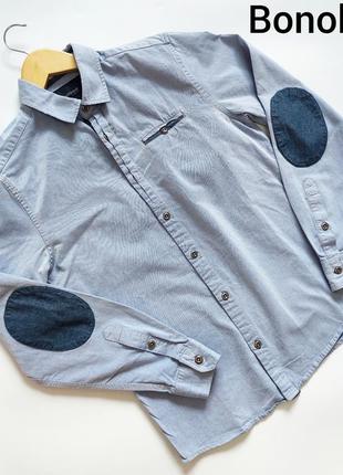 Мужская джинсовая светлая рубашка на пуговицах с карманом от бренда bonobo jeans1 фото