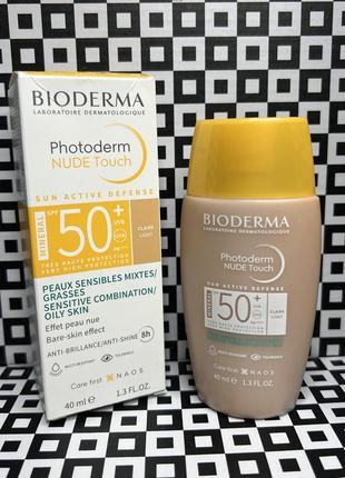 Тонирующий солнцезащитный крем bioderma photoderm nude touch spf 50 тон светлый1 фото