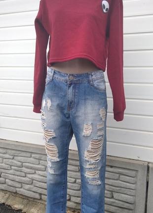 Рваные джинсы женские1 фото