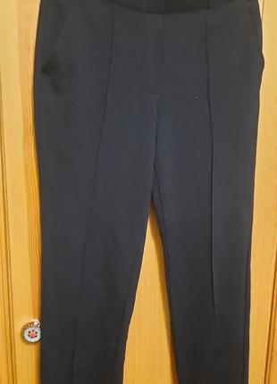 Женские трикотажные брюки с боковыми карманами и кантами