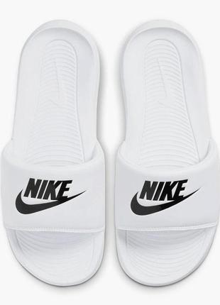 Pink and white nike slides sales
