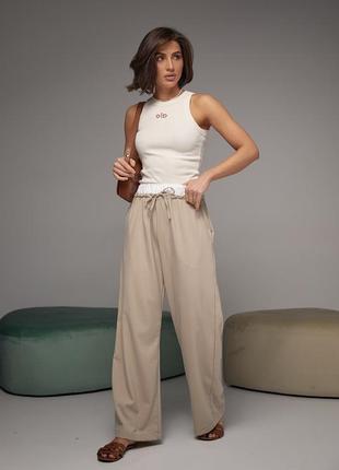 Женские брюки на завязках с белой резинкой на талии4 фото