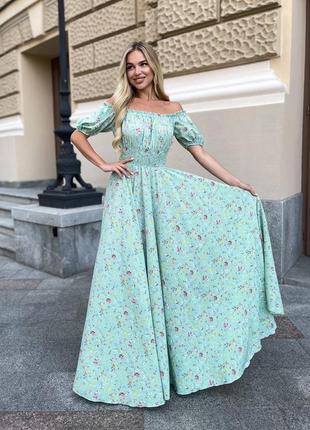 Женское длинное зеленое изящное стильное трендовое платье макси на резинке с цветочным принтом.4 фото