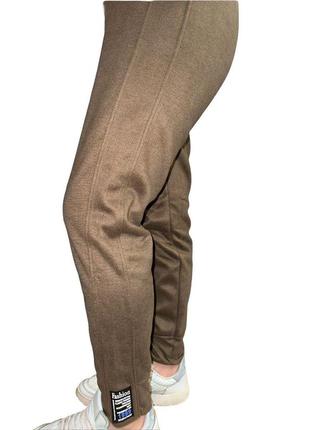 Теплые женские штаны на меху на резинке с высокой посадкой с карманами цвет олива размер 42-488 фото