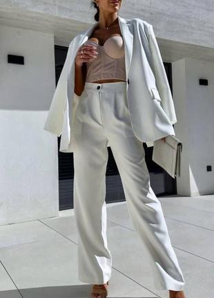 Костюм жіночий однотонний класичний оверсайз піджак на гудзику штани вільного крою на високій посадці якісний базовий білий