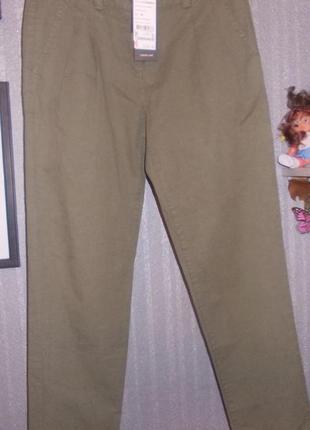 Нові штани хлопкові колір хакі 44-46р. зі складочками зпереду.