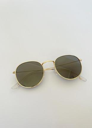 Стильні окуляри із золотистою оправою3 фото
