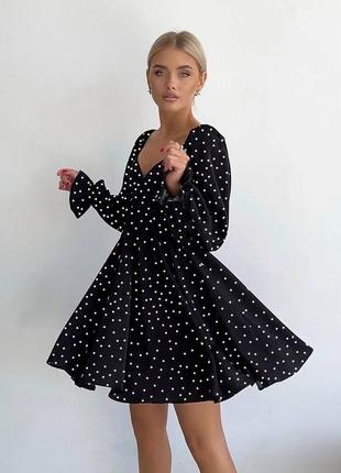 Платье женожа свободного кроя в горошек черного цвета3 фото