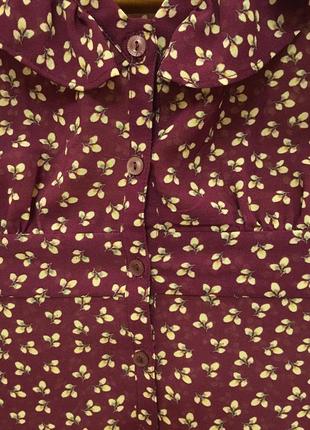 Очень красивая и стильная брендовый блузка в цветашках.3 фото