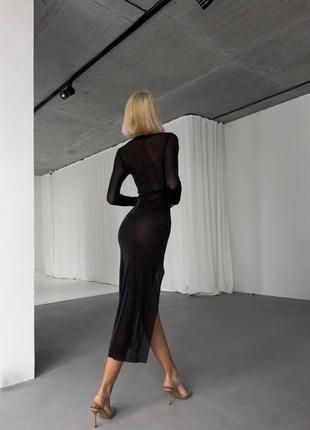 Чорна прозора сукня в сіточку з гарним вирізом на ніжці3 фото