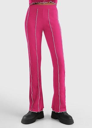 Рожевий костюм tommy jeans10 фото