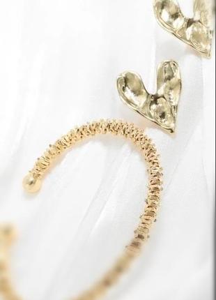 Романтичний набір прикрас з 2 предметів: сережки-сердечки та "шипований" браслет.7 фото