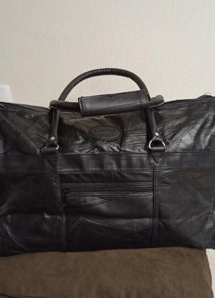 Новая дорожная кожаная сумка,легкая, что очень важно для дорожной клади.5 фото
