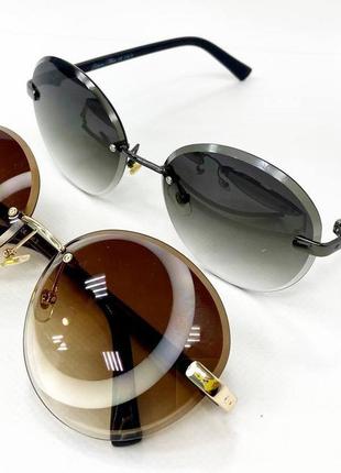 Окуляри сонцезахисні жіночі безоправні круглі з легким тонуванням тоненькі пластикові дужки