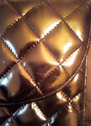 Стильна сумочка-клатч, золотистого кольору.5 фото