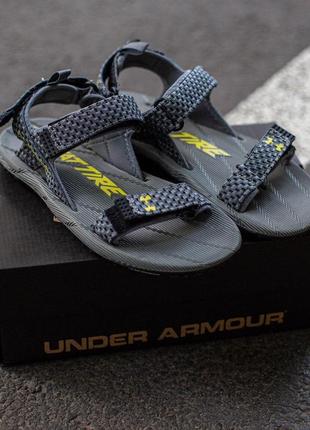 Мужские сандалии Under Microg armour expects full year revenue to increase between 5% and 7tire sandala x michelin grey\yellow