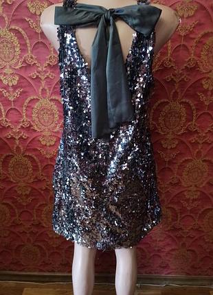 Серебристое платье вечера в пайетки с бантом 14 размер короткого платья с блестками и большим бантом на спине