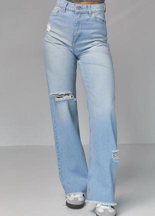 Жіночі джинси з рваними елементами6 фото