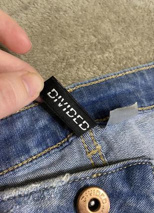Прямі джинси зі вставками на колінах4 фото