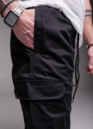 Штани джогери чорного кольору з накладеними кишенями5 фото