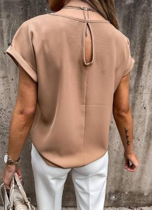 Блузка з красивим вирізом у вигляді крапельки на спині2 фото