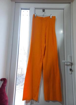 Оранжеві брюки в рубчик висока посадка