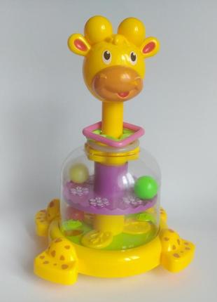 Яскрава іграшка жираф, дзига жираф