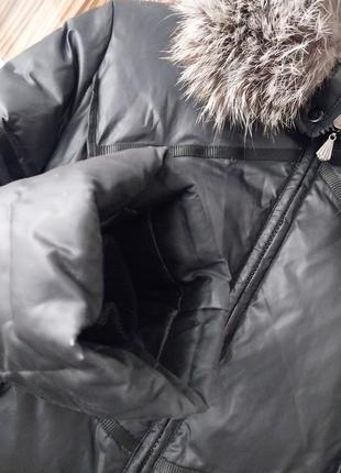 Длинное пальто пуховик с капюшоном с натуральным мехом енота10 фото