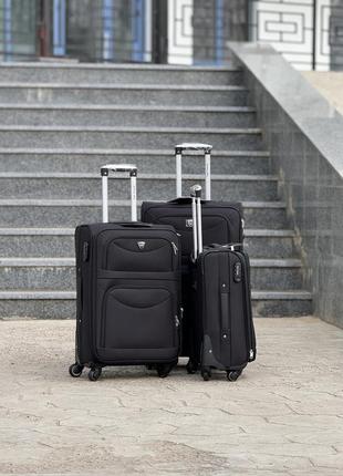 Середня валіза дорожня тканинна m польща на колесах wings з підшипником2 фото