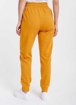 Женские спортивные штаны из трикотажа с накладными карманы2 фото
