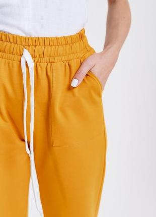 Женские спортивные штаны из трикотажа с накладными карманы4 фото