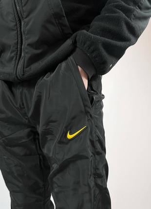 Трендові нейлонові чоловічі штани nike nocta чорного кольору