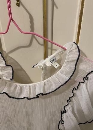 Блузка сорочка прозора білого кольору із оборкою високою горловиною мереживна2 фото