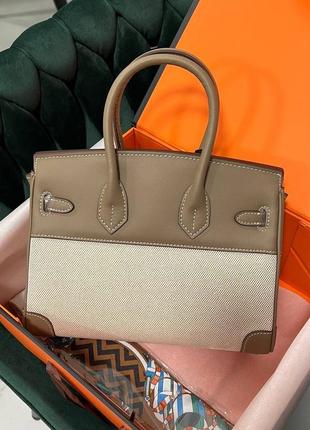 Женская сумка hermes birkin выполнена из текстиля и кожи с серебряной фурнитурой.4 фото