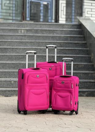 Середня валіза дорожня тканинна m польща на колесах wings з підшипником1 фото