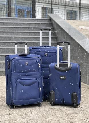 Середня валіза дорожня тканинна m польща на колесах wings з підшипником3 фото