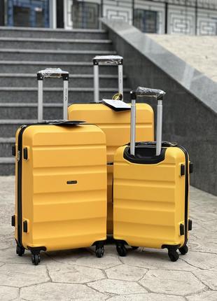 Ударопрочный wings средний чемодан дорожный m на колесах польша 75 литров2 фото