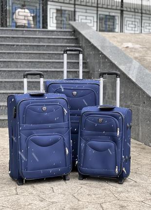 Велика валіза дорожня тканинна l польща на колесах wings з підшипником1 фото