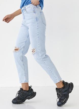 Жіночі джинси рвані на колінах3 фото