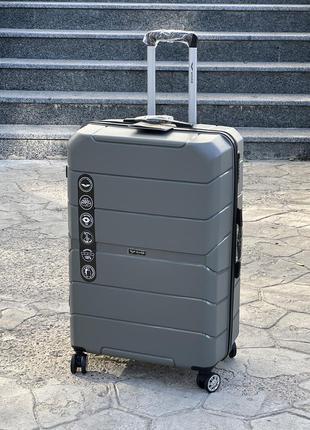 Полипропилен wings средний чемодан дорожный m на колесах польша 75 литров8 фото